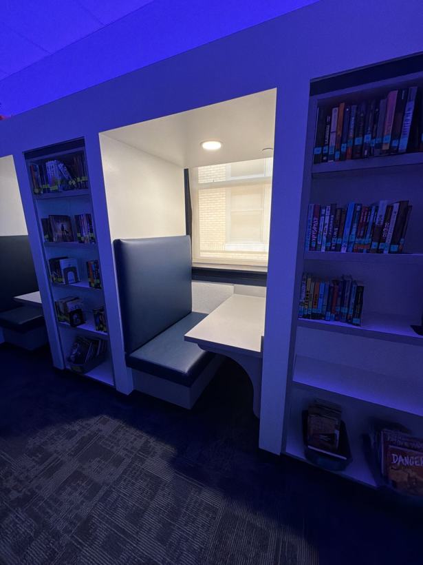 Built-in study booths between bookshelves.