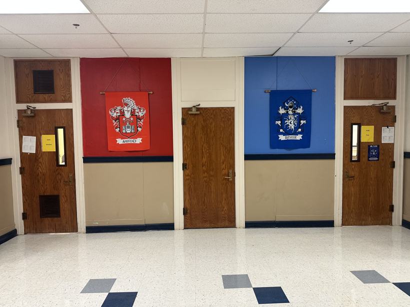 Hallway painted in house colors with Amistad and Reveur crest banners.