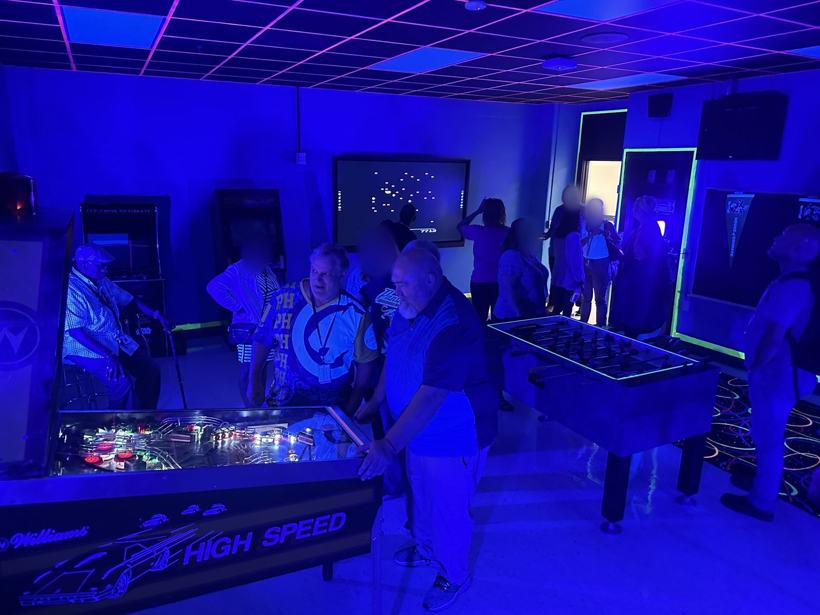 Visitors in the arcade during an open house. Some faces blurred.