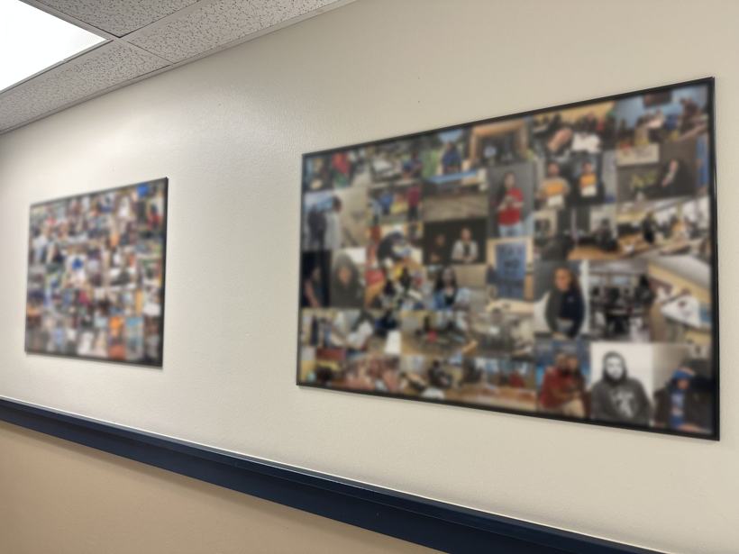 Two large framed collages of student photos in a hallway, blurred here to protect students.